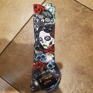 Spirit Halloween Knee high women's socks. Skulls and Día de los Muertos.